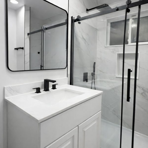 Luxury master bathroom remodel with white marble finish.