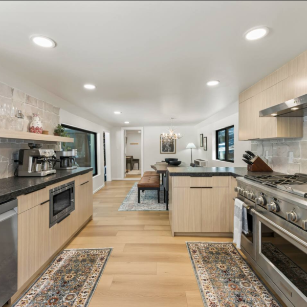 Wide view of a modern open-concept kitchen and living area.